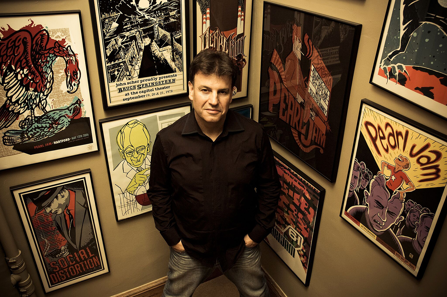 DJ Rich Russo in front of his collection of concert posters